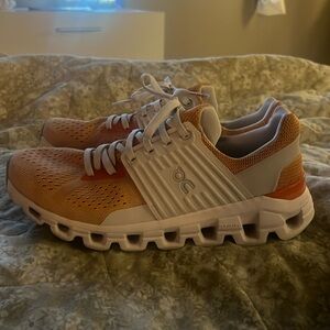 orange and white on cloud helions